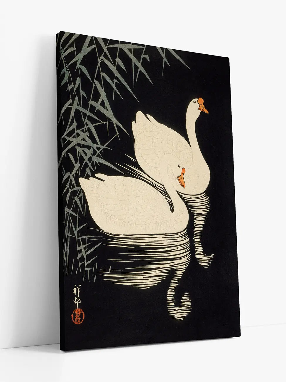 Two Geese Swimming Near Reeds