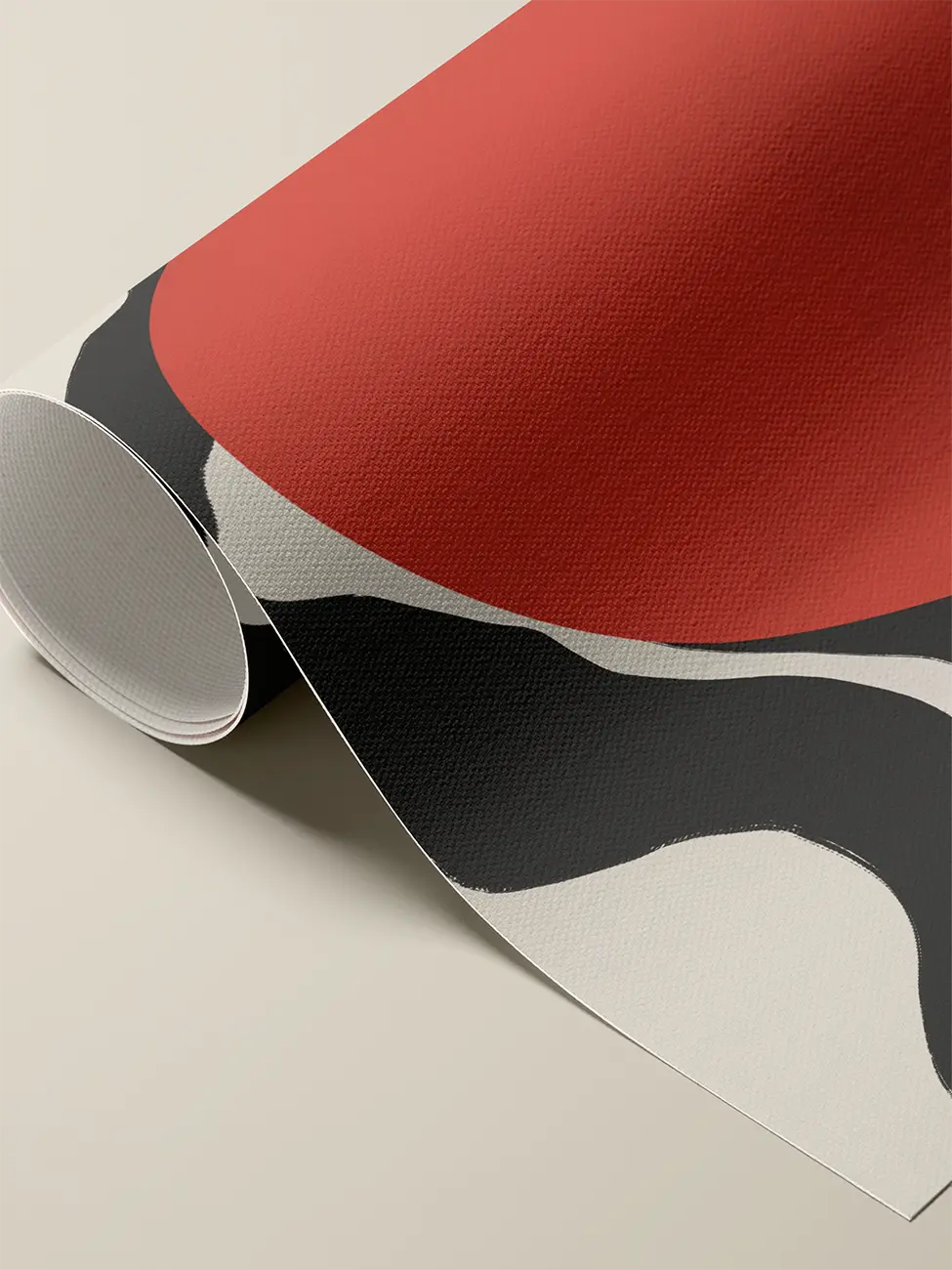 Close up of rolled canvas art print with abstract red, black, and white shapes on a beige background