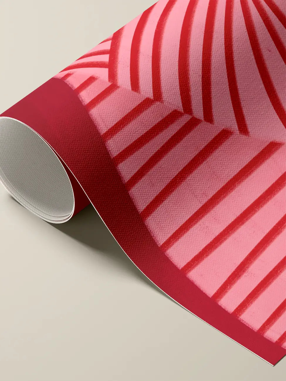 A rolled cotton canvas print featuring a painted pattern of alternating pink and red diagonal stripes on deep red background.